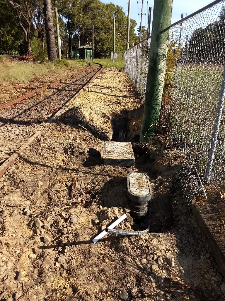 Electrical pits have been laid next to the National Park line. These provide the change of direction for the ducts, which then run underground alongside the track to the No.2 substation.